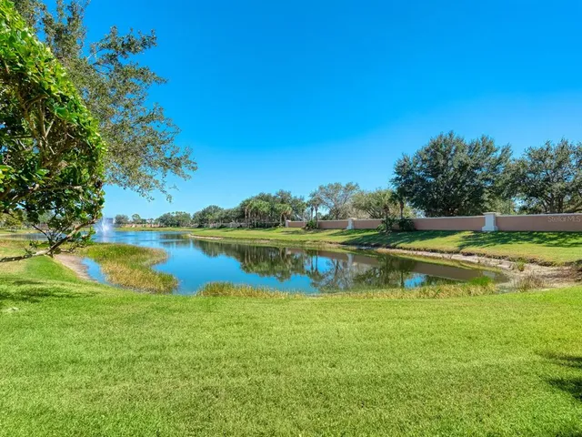 a view of a lake with a big yard