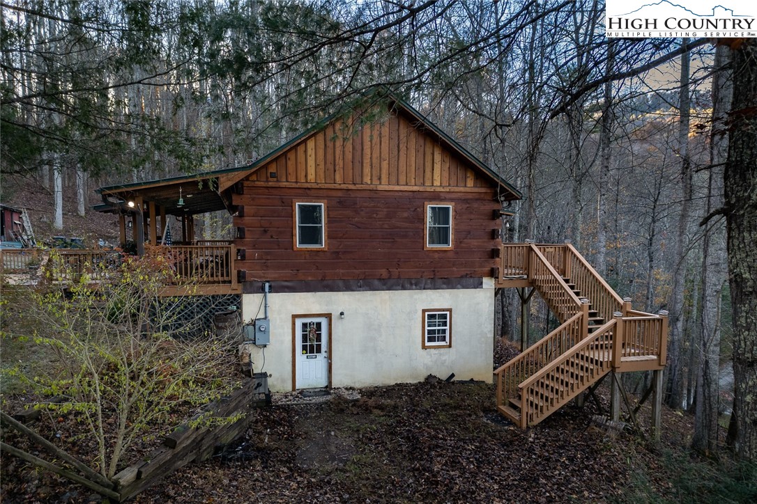 2417 Russell Norris Road Elk Park, NC 28622 - Photo 19 of 22 a view of a house with a yard