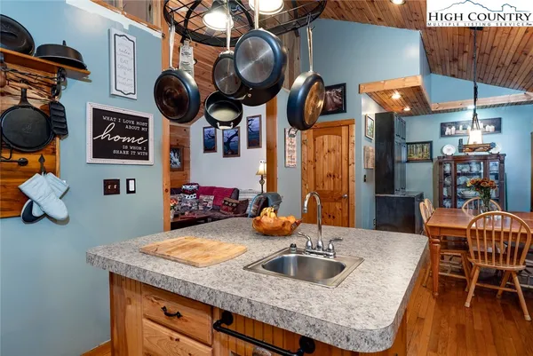 a kitchen with a table and a chair
