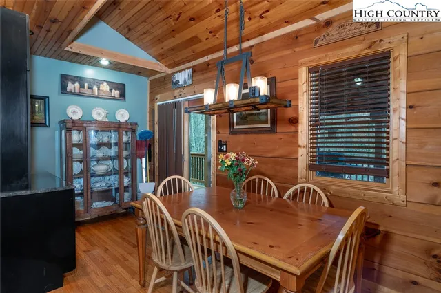 a view of a patio with table and chairs with wooden floor