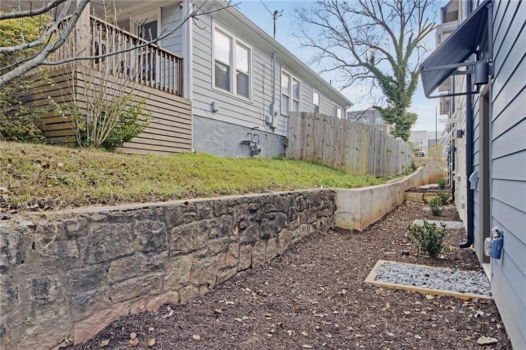 1070 Dill Avenue Southwest, Unit 104 Atlanta, GA 30310 - Photo 16 of 18 a view of a house with a yard