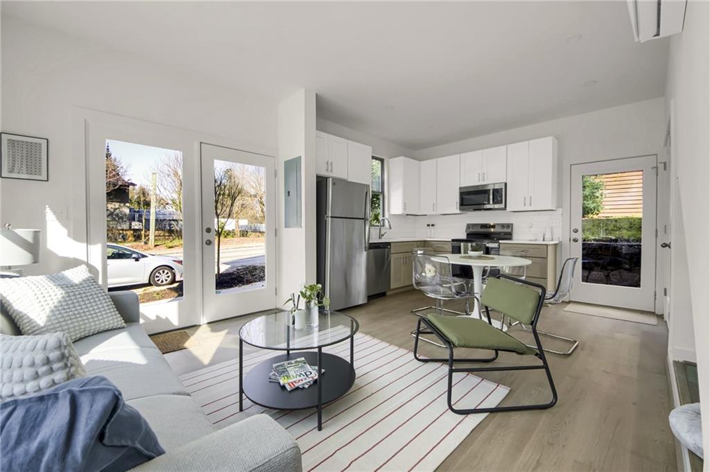 1070 Dill Avenue Southwest, Unit 104 Atlanta, GA 30310 - Photo 3 of 18 a living room with furniture and a view of kitchen