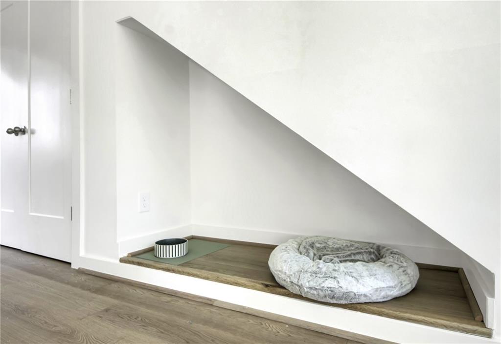 1070 Dill Avenue Southwest, Unit 104 Atlanta, GA 30310 - Photo 8 of 18 a view of a room with wooden floor and shoes