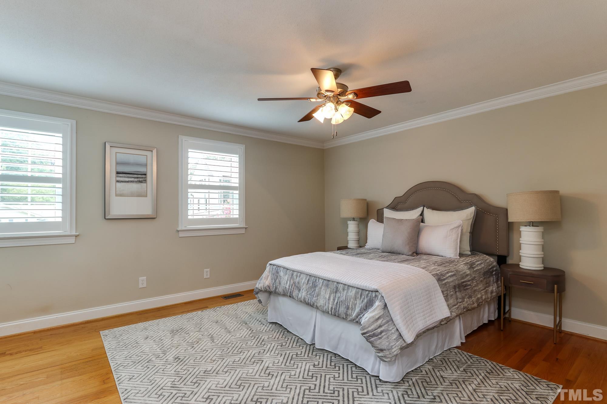4804 Rampart Street Raleigh, NC 27609 - Photo 13 of 27 a bedroom with a bed and a window