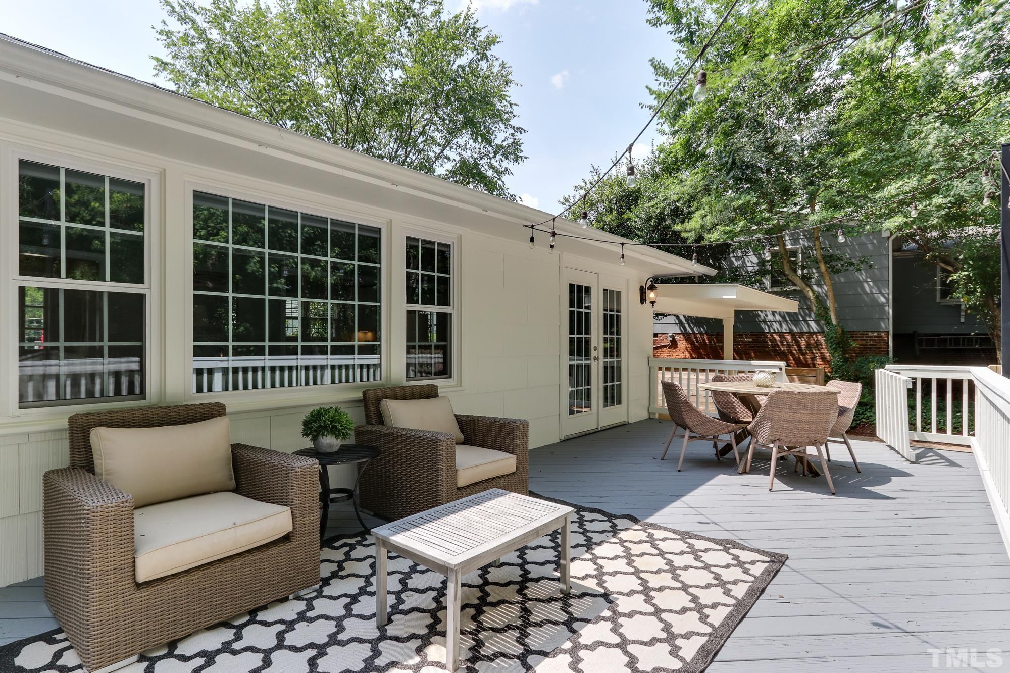 4804 Rampart Street Raleigh, NC 27609 - Photo 25 of 27 a balcony with furniture and potted plants