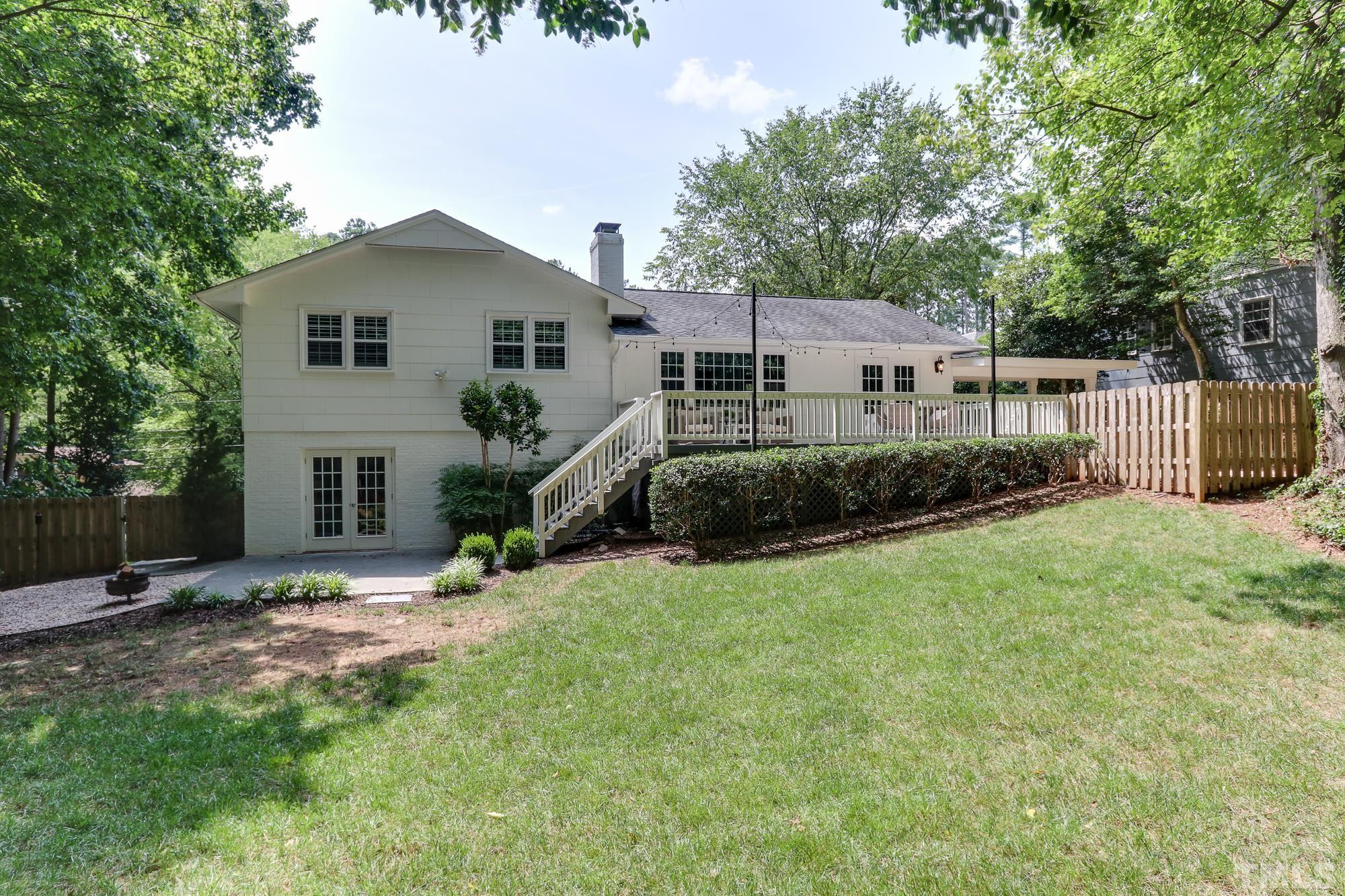 4804 Rampart Street Raleigh, NC 27609 - Photo 27 of 27 a view of a house with backyard and sitting area