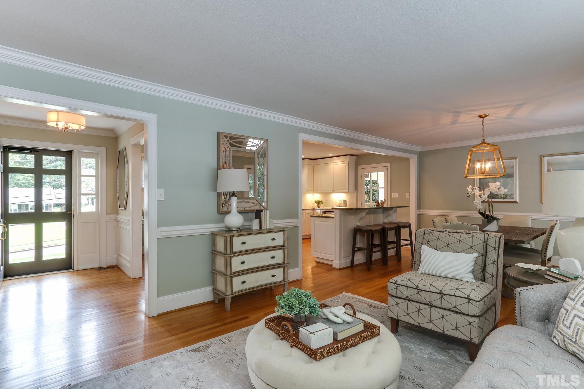 4804 Rampart Street Raleigh, NC 27609 - Photo 6 of 27 a living room with furniture and a wooden floor