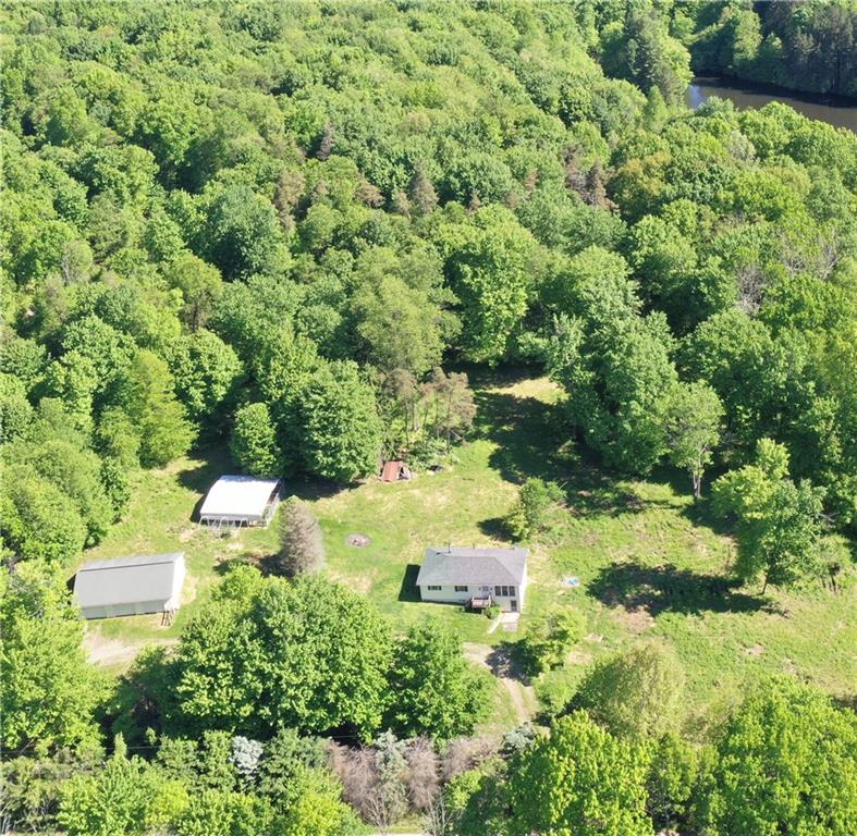 323 Boyers Road--3 car detached garage, plenty of yard for gardening, woods for hunting and lake frontage for fishing.