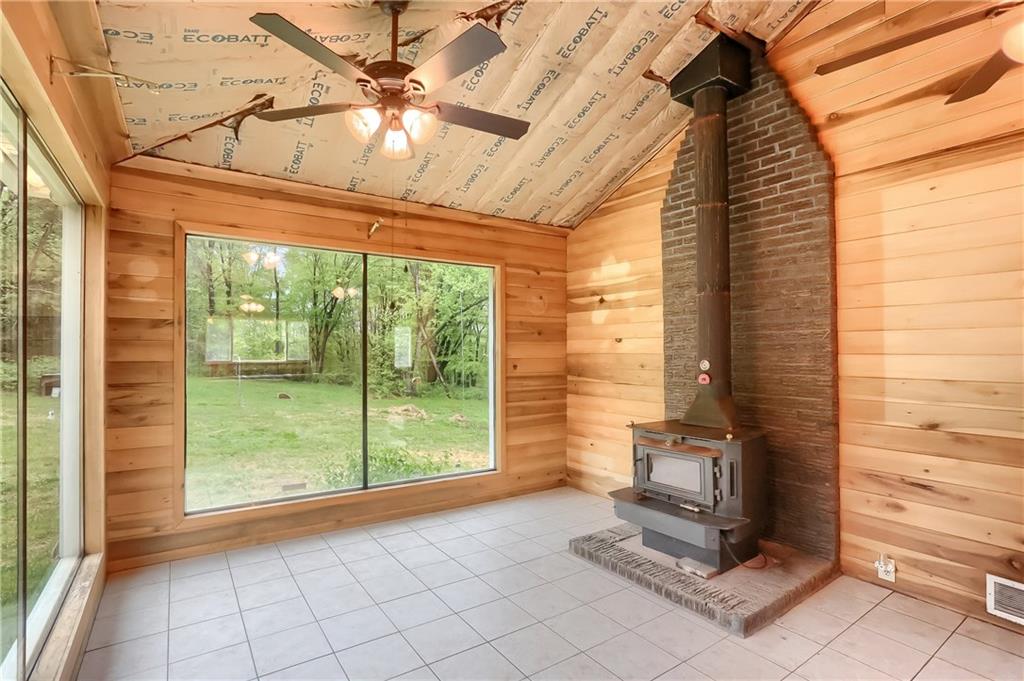 323 Boyers Road Harrisville, PA 16038 - Photo 11 of 25 The cozy sitting area could serve a variety of functions--mudroom, dining area, or sitting room.