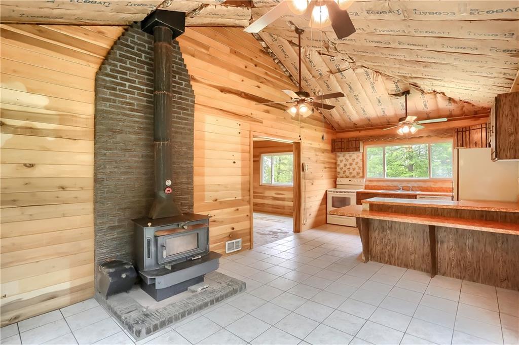 323 Boyers Road Harrisville, PA 16038 - Photo 12 of 25 Cozy kitchen and sitting room area with vaulted ceilings and huge windows.