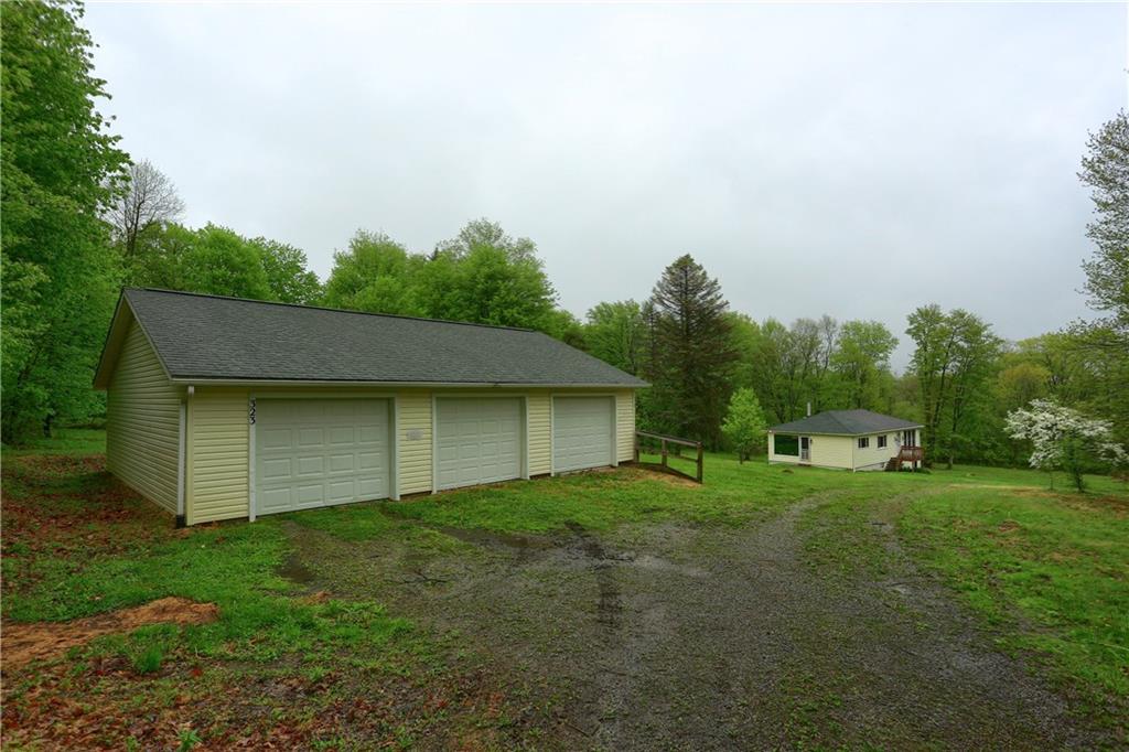 The 3 car garage provides space for cars, tractors, storage, and hobbies.