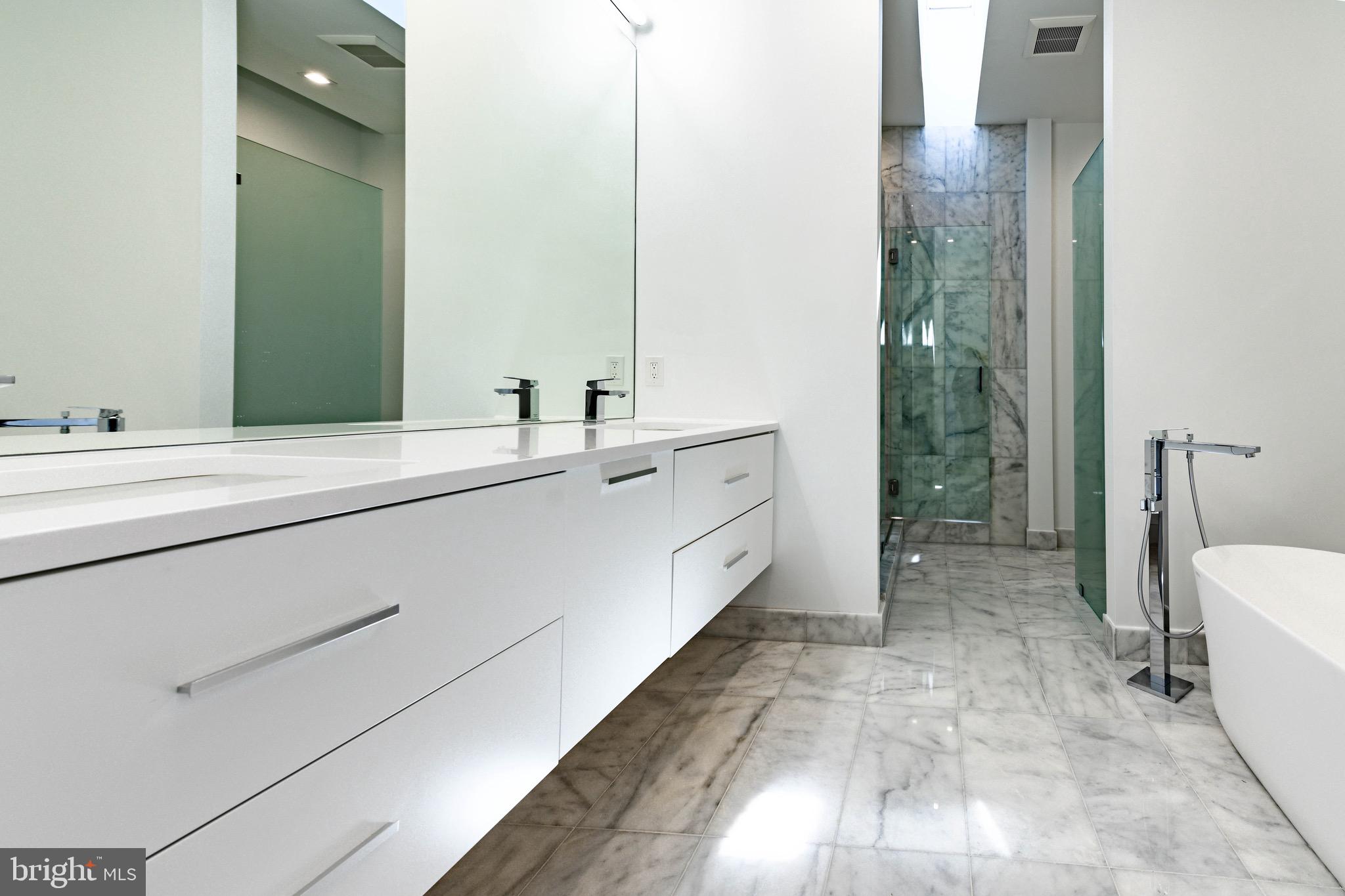 6210 Wedgewood Road Bethesda, MD 20817 - Photo 28 of 60 Main level luxurious marble, frameless master bath