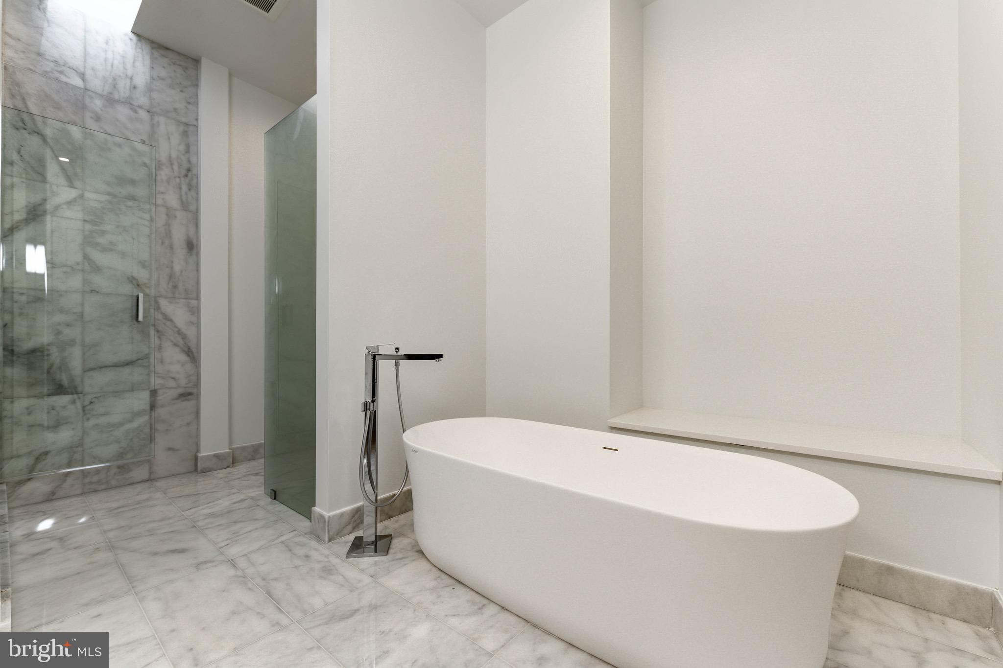 6210 Wedgewood Road Bethesda, MD 20817 - Photo 29 of 60 Main level luxurious marble, frameless master bath