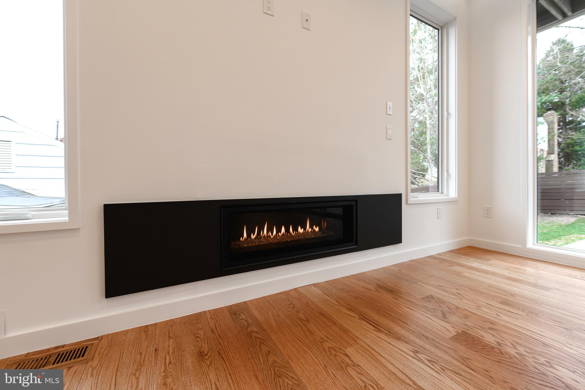 6210 Wedgewood Road Bethesda, MD 20817 - Photo 5 of 60 Spacious light filled family room with Glass Fire
