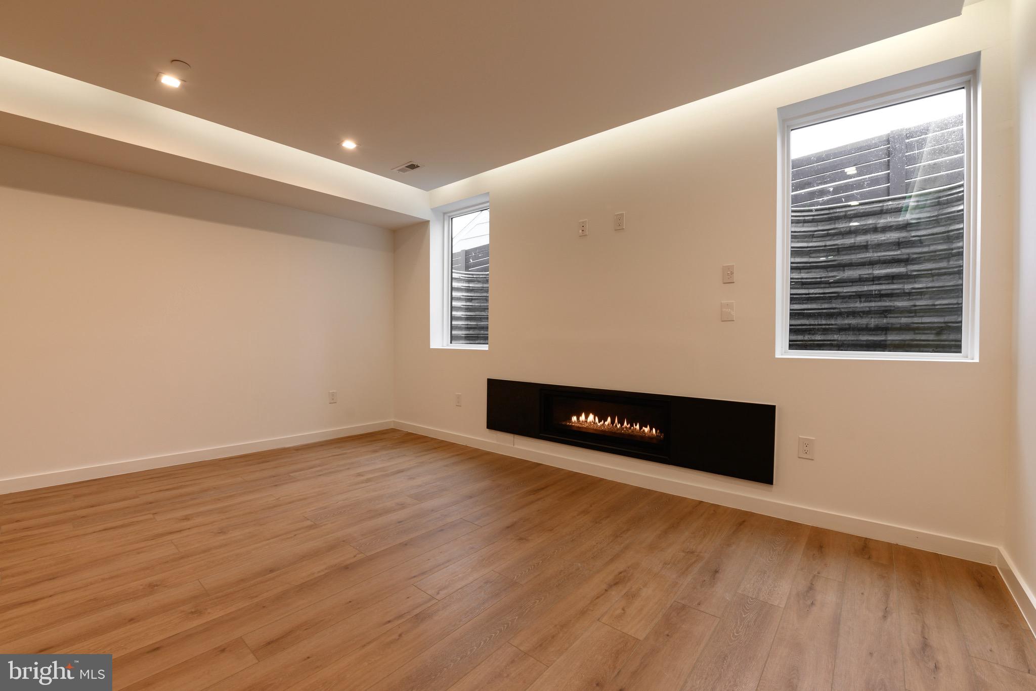6210 Wedgewood Road Bethesda, MD 20817 - Photo 53 of 60 Lower Level Recreation/family room with Glass Fire