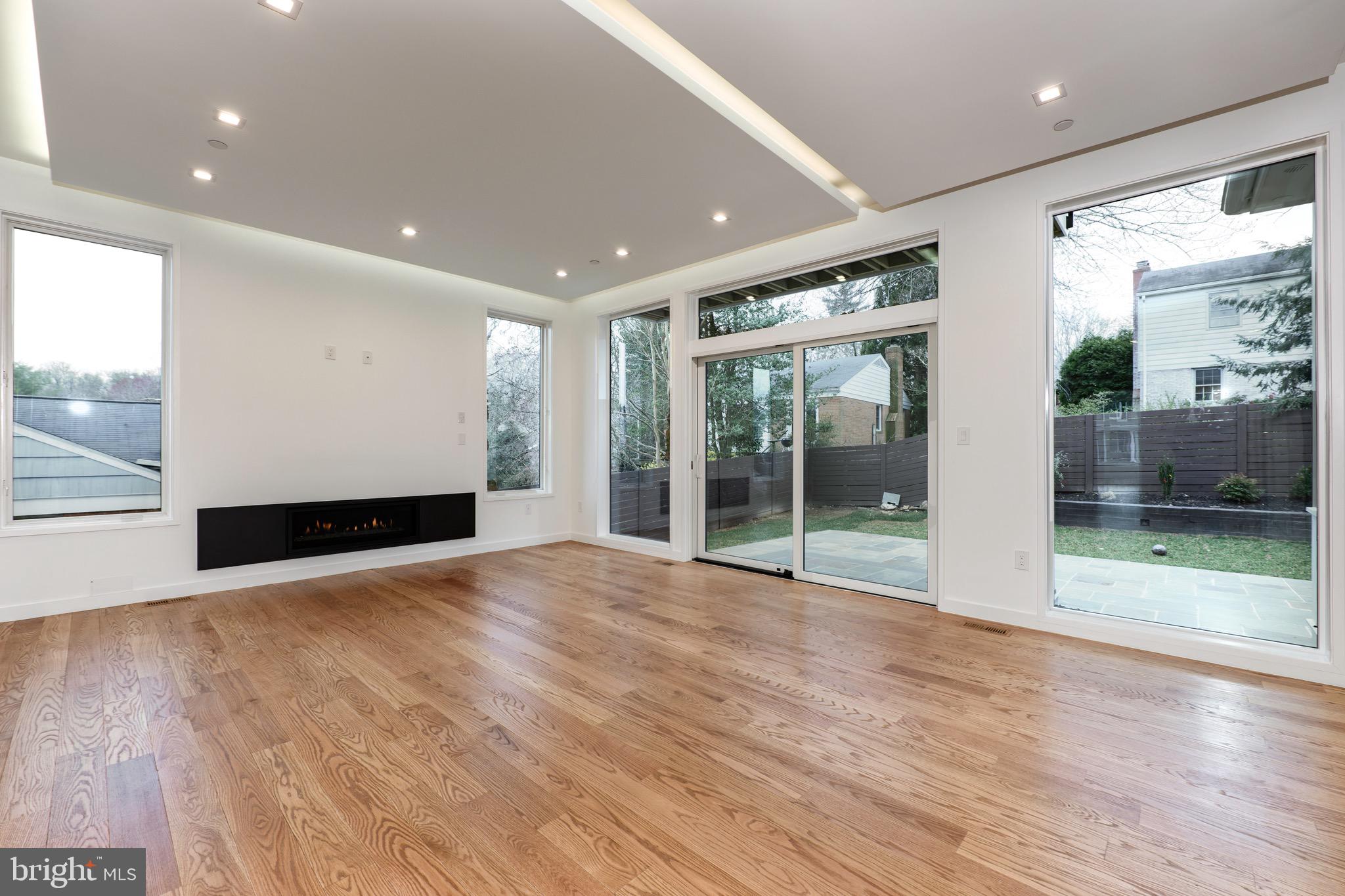 6210 Wedgewood Road Bethesda, MD 20817 - Photo 7 of 60 Spacious light filled family room with Glass Fire
