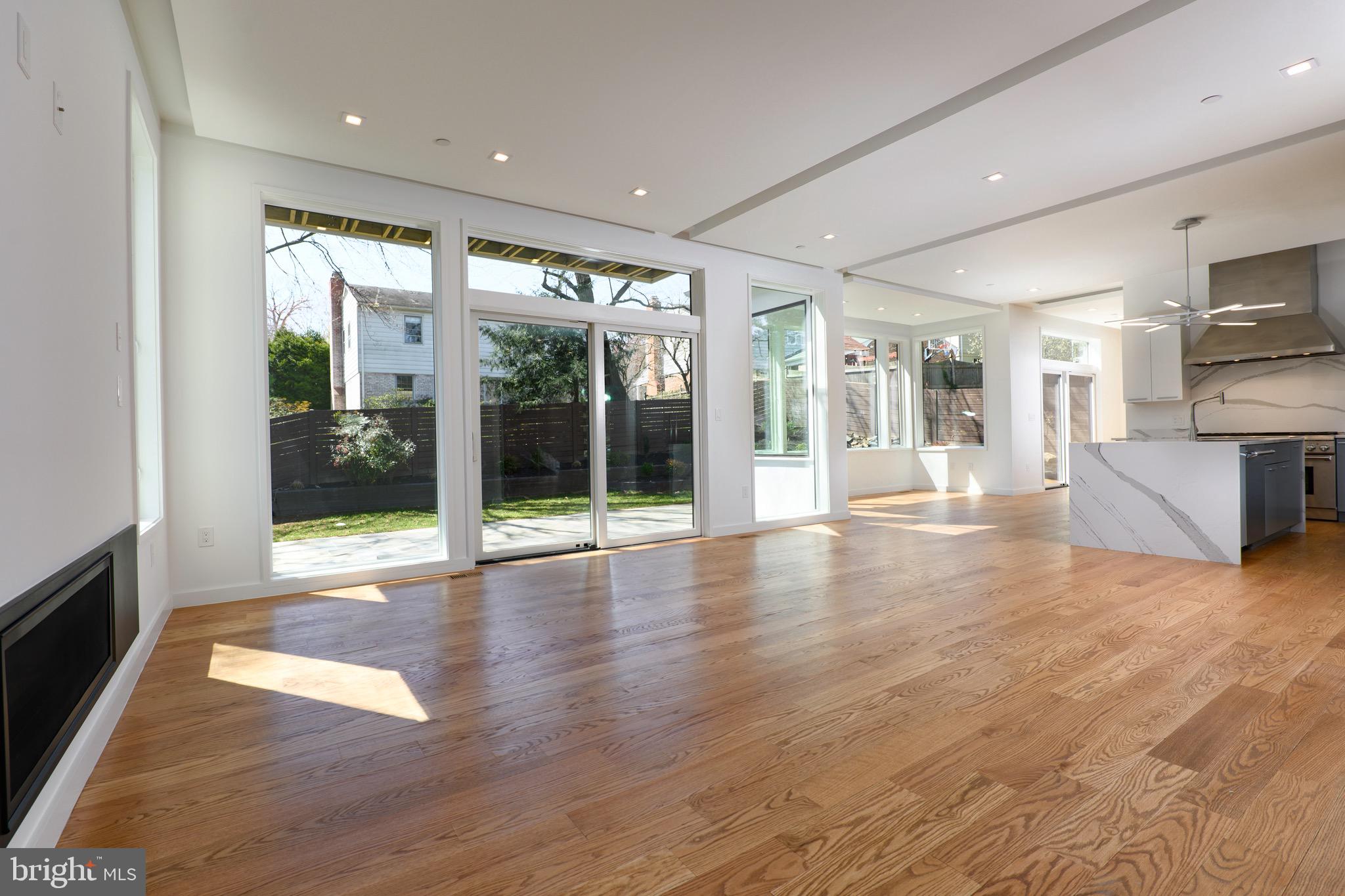 6210 Wedgewood Road Bethesda, MD 20817 - Photo 8 of 60 Spacious light filled family room with Glass Fire