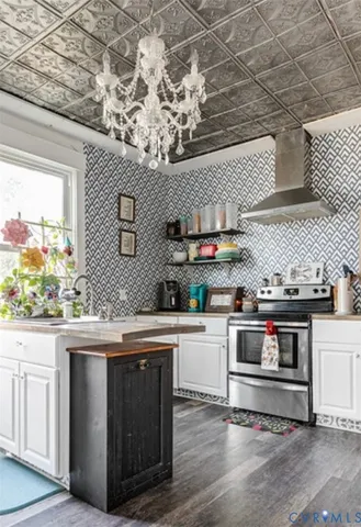 a kitchen with stainless steel appliances granite countertop a stove and a sink