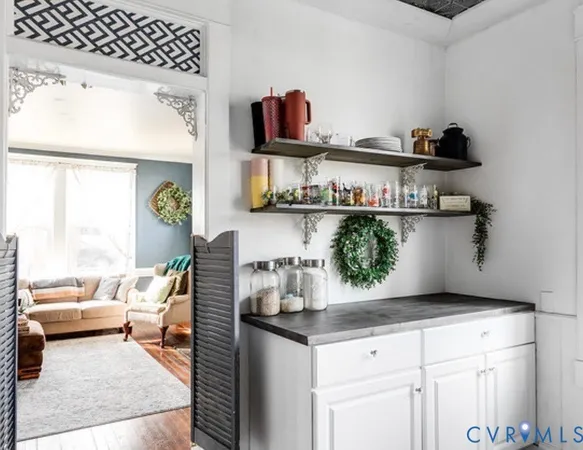 a kitchen with a stove and cabinets