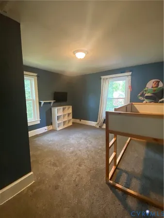 a room with furniture and window