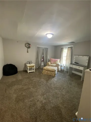 a bedroom with a bed and a chair