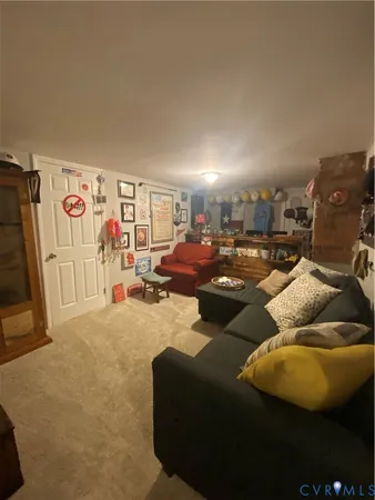 a living room with furniture a couch and musical instruments