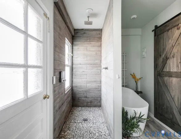 a bathroom with a tub and shower