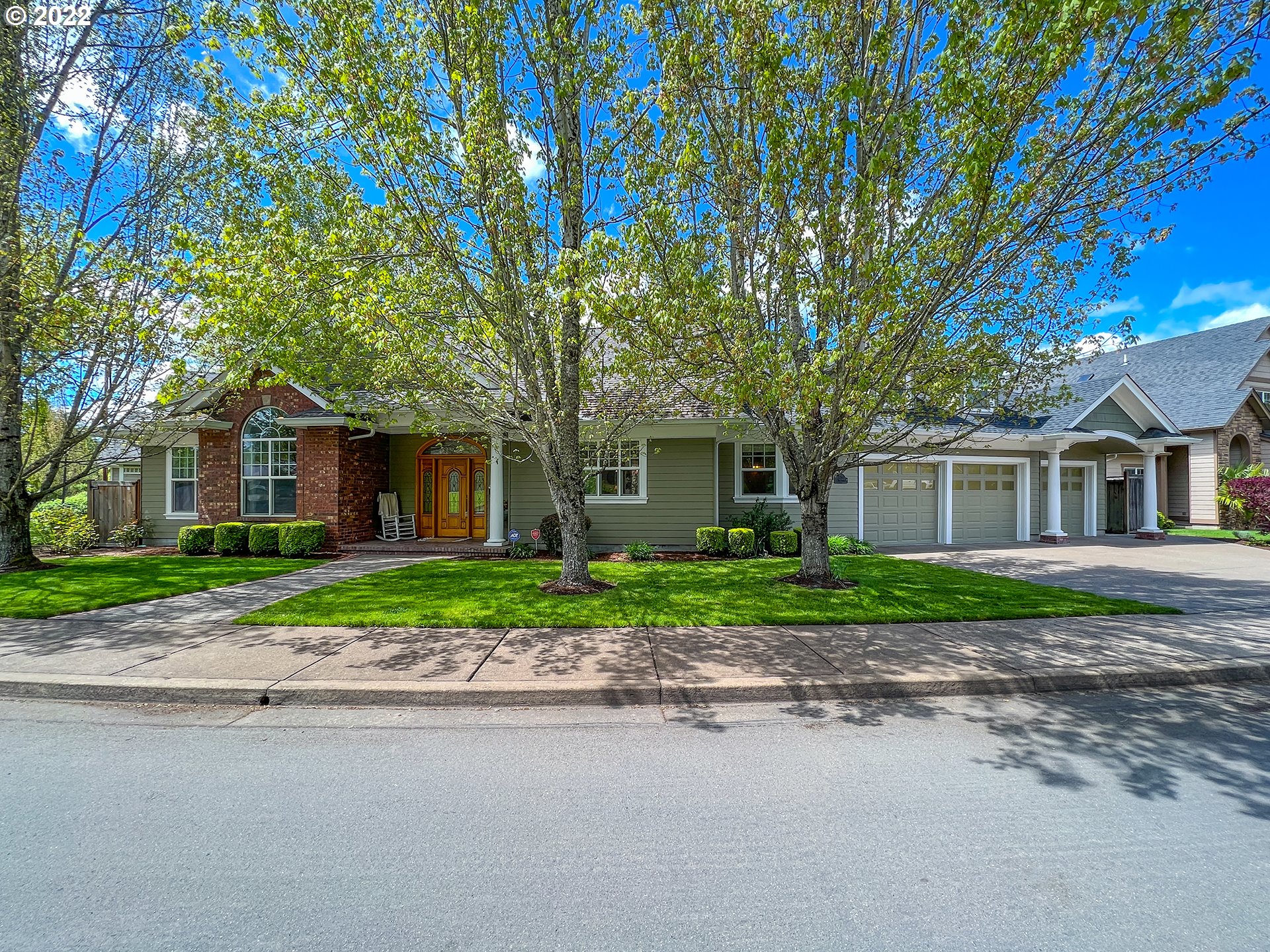 2258 33rd Street Springfield, OR 97477 - Photo 1 of 32 a front view of a house with a yard and a garage