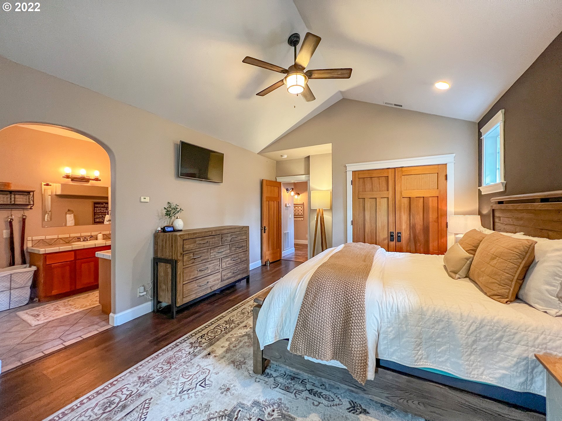 2258 33rd Street Springfield, OR 97477 - Photo 11 of 32 a bedroom with a large bed a flat tv screen and dresser