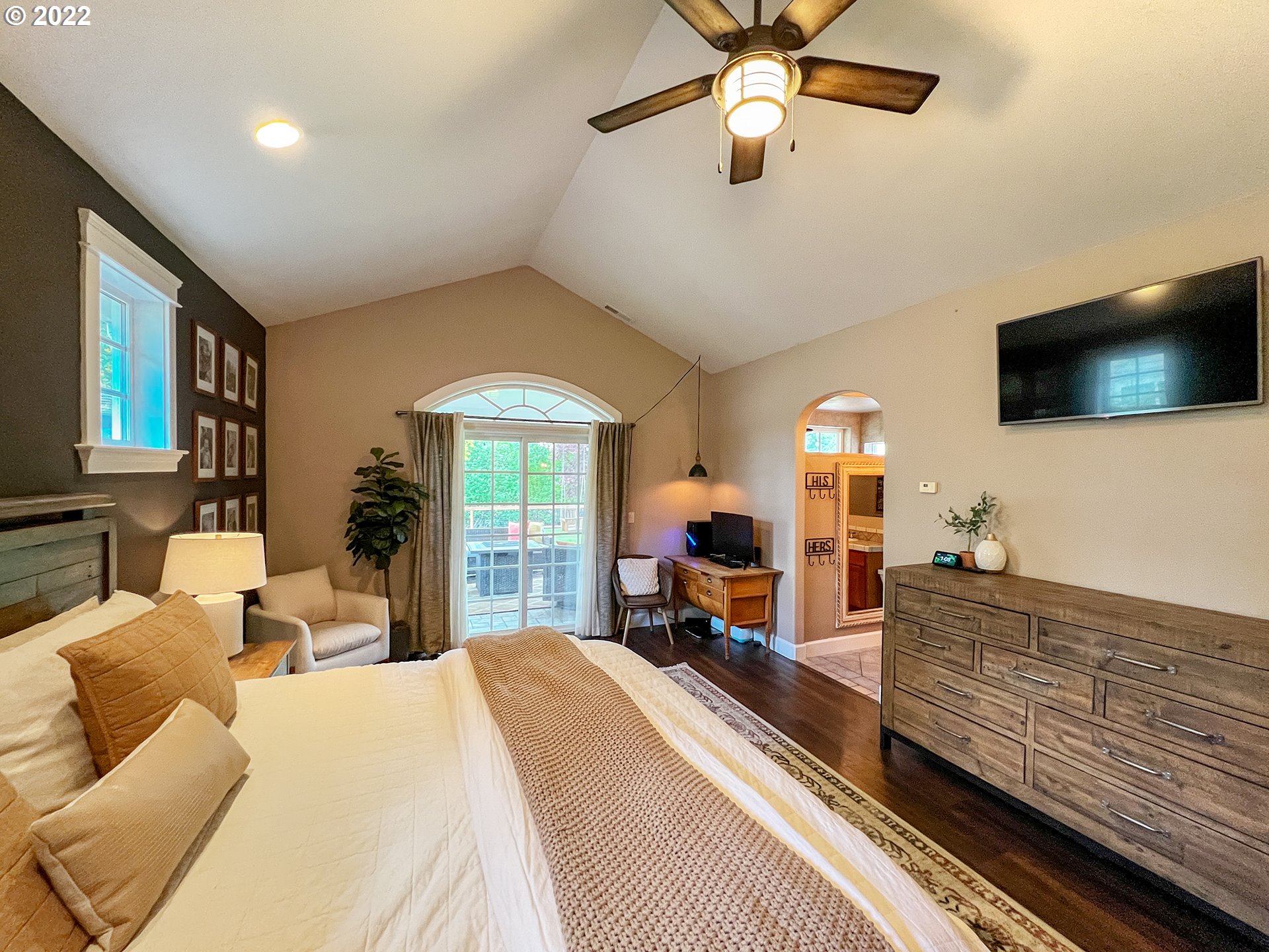2258 33rd Street Springfield, OR 97477 - Photo 12 of 32 a bed room with a bed window and a flat screen tv