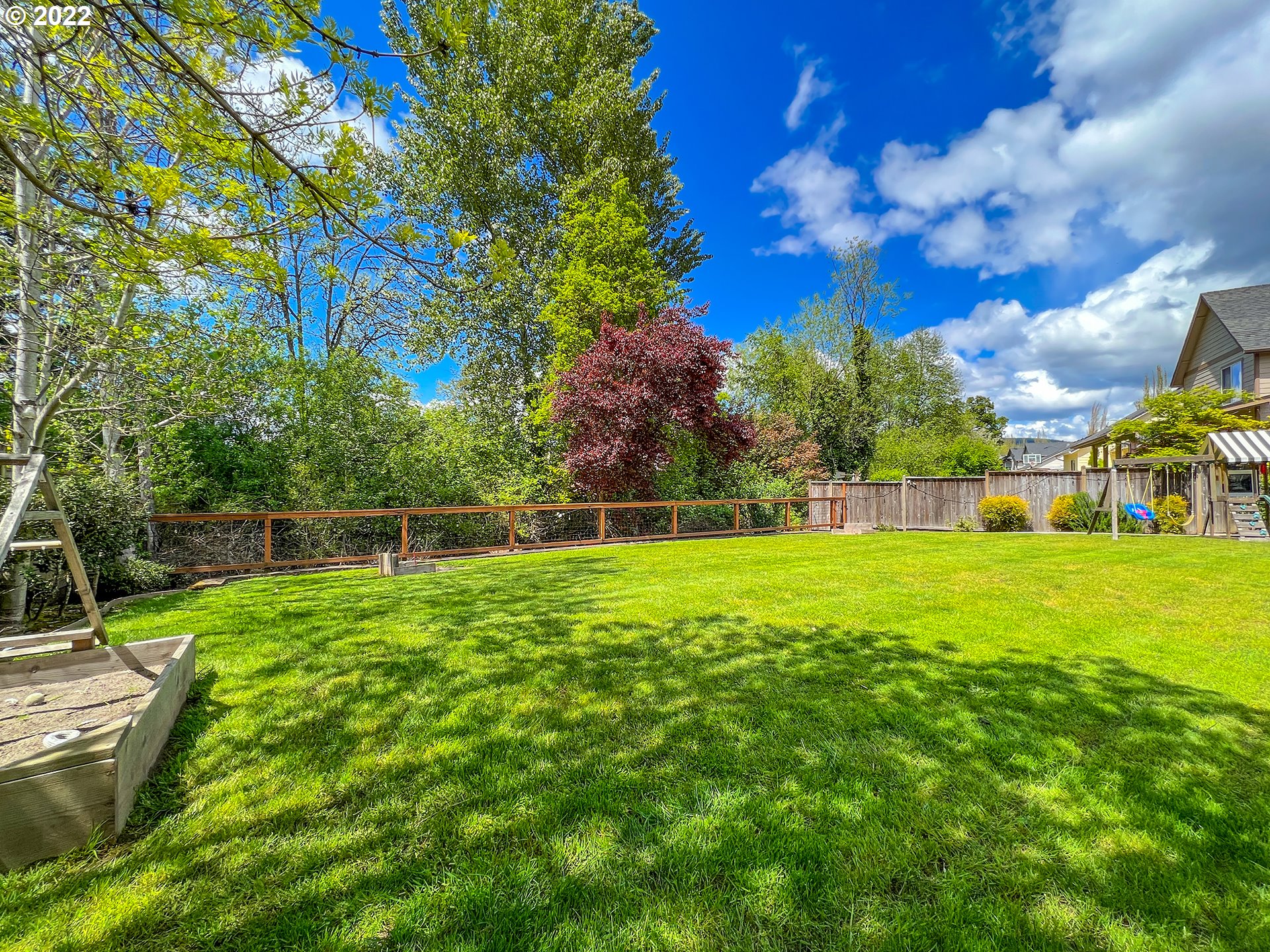 2258 33rd Street Springfield, OR 97477 - Photo 27 of 32 a view of yard with swimming pool and green space