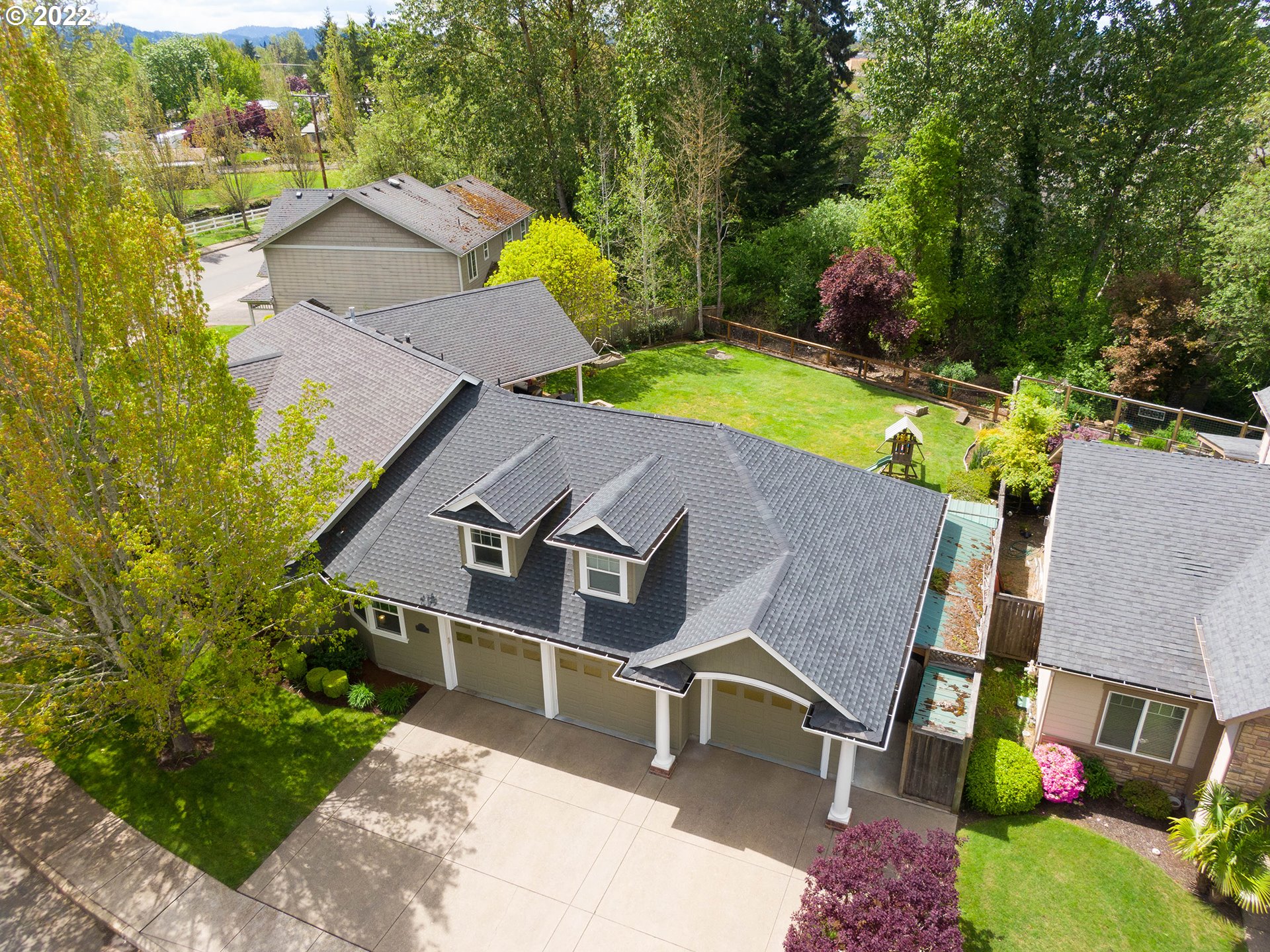2258 33rd Street Springfield, OR 97477 - Photo 29 of 32 an aerial view of a house with a swimming pool yard and outdoor seating