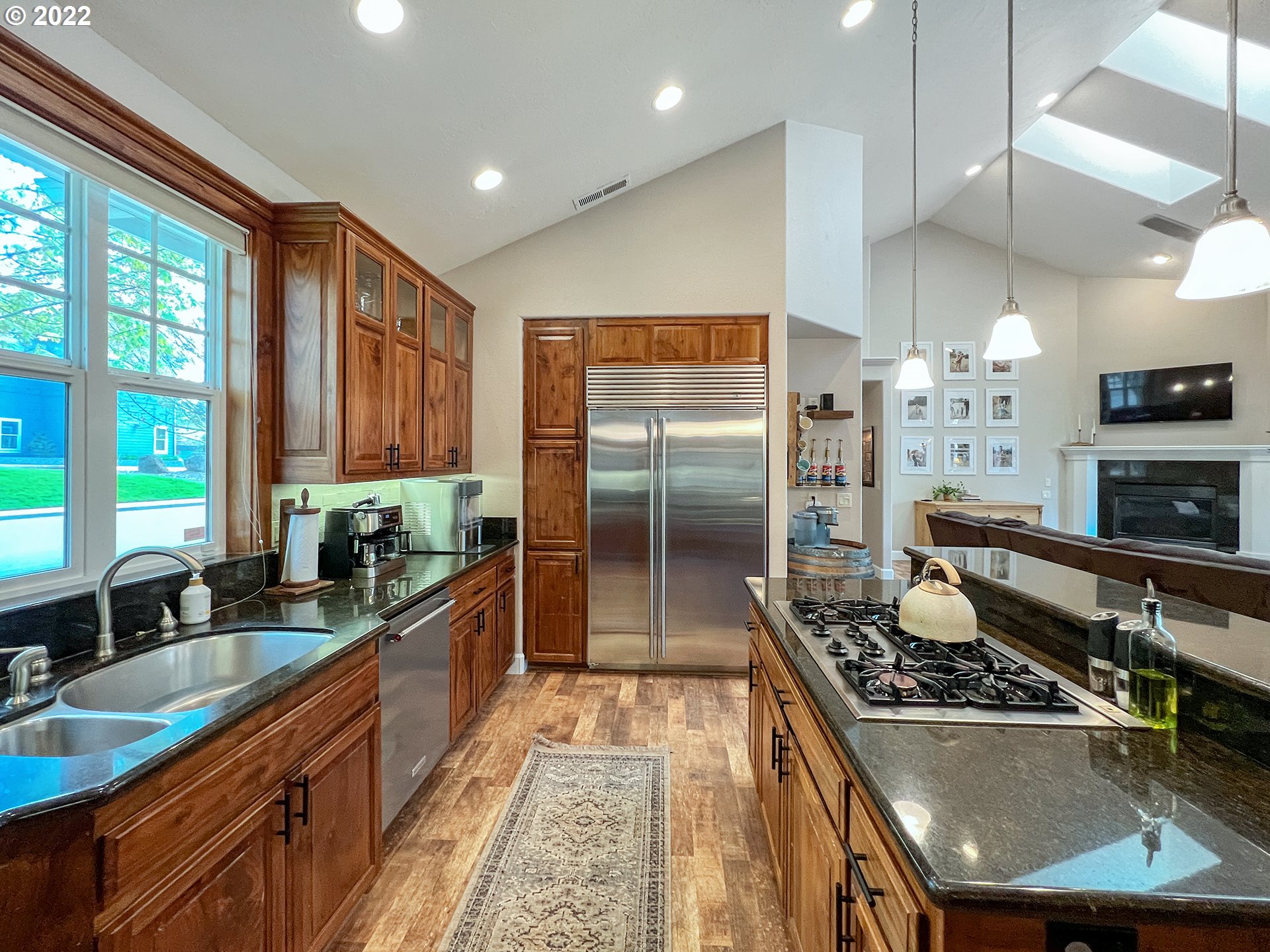 2258 33rd Street Springfield, OR 97477 - Photo 5 of 32 a kitchen with stainless steel appliances granite countertop a sink stove and refrigerator