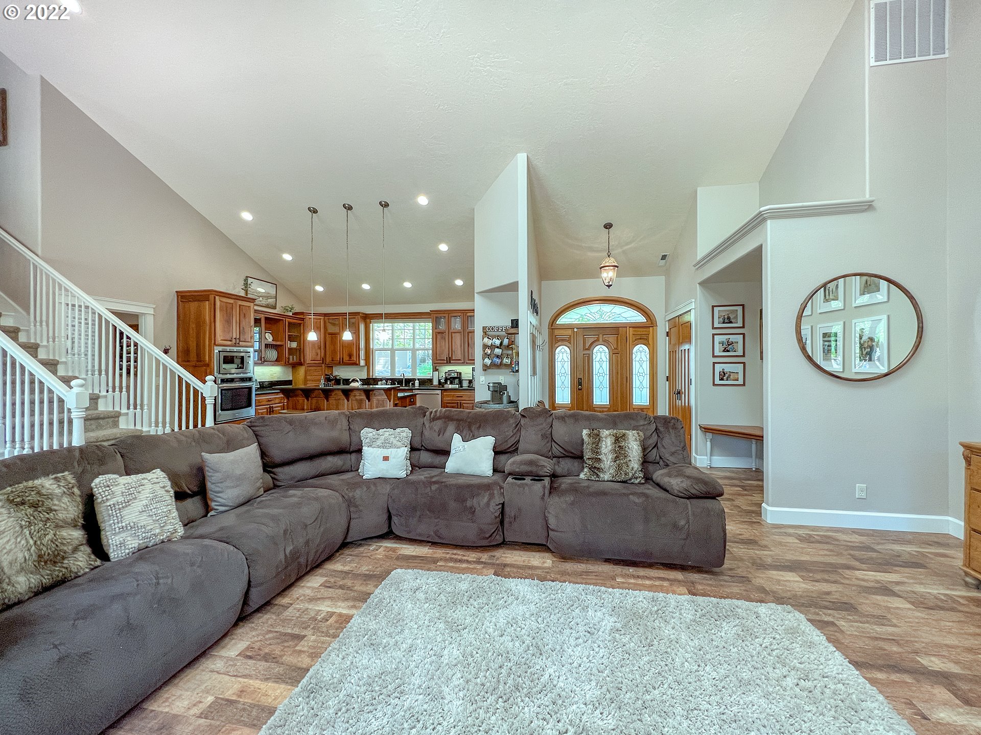 2258 33rd Street Springfield, OR 97477 - Photo 7 of 32 a living room with furniture a clock on wall and a large window