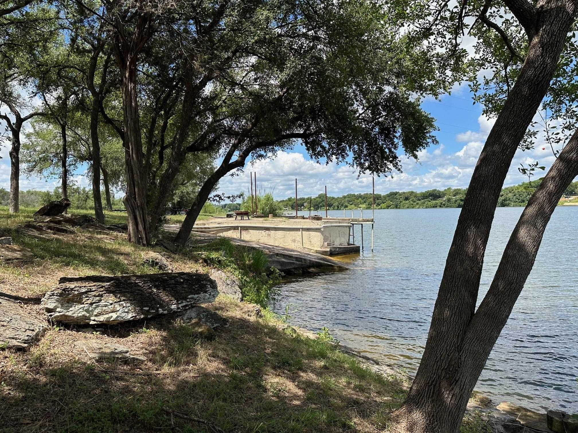 Unk Old River Road Marble Falls, TX 78654 - Photo 4 of 8 a view of a lake with wooden fence