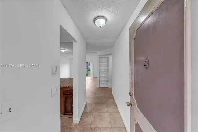 a view of a hallway with closet