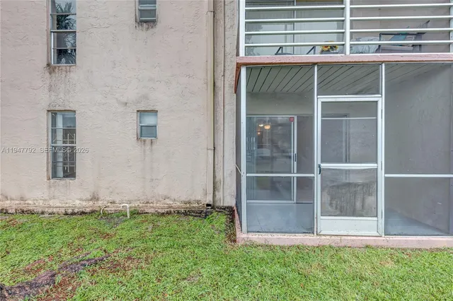a view of house with backyard