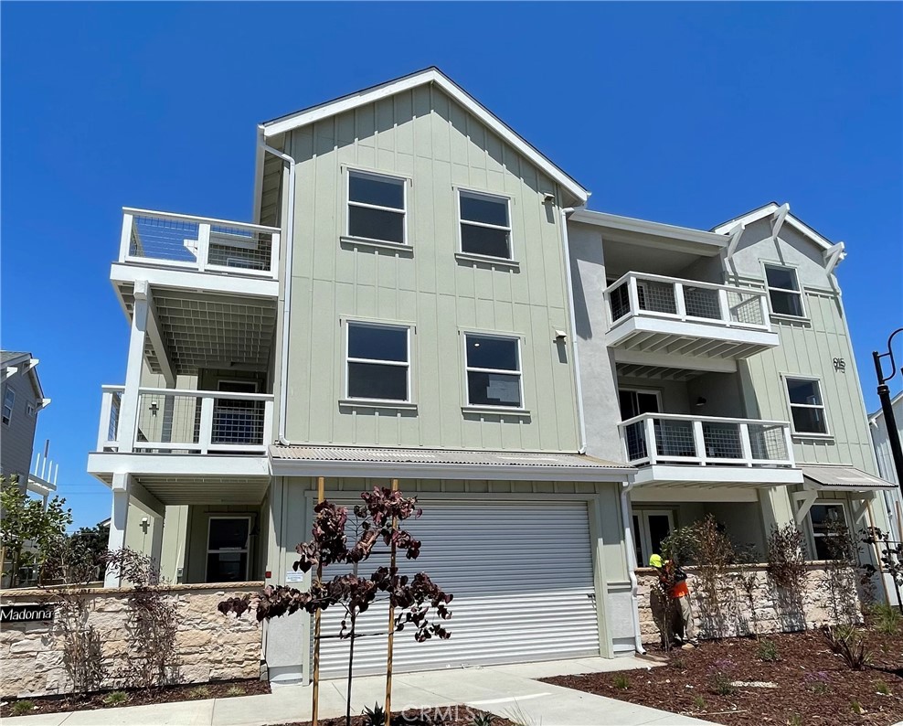 a front view of a house with garage