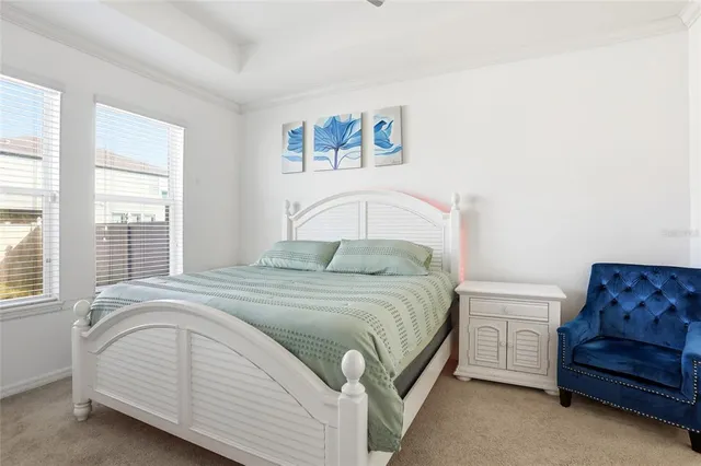 a bedroom with a bed and a couch