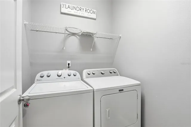 a utility room with dryer and washer