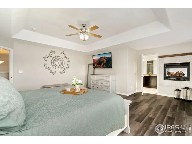 a view of a livingroom with furniture and a flat screen tv