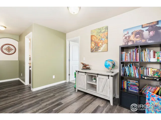 a kitchen with a refrigerator and a sink