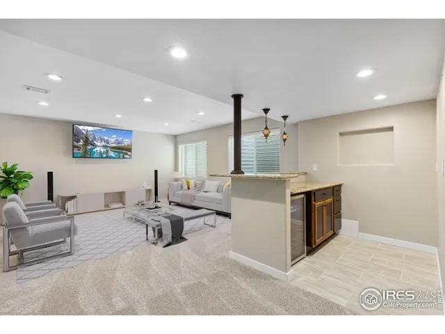a kitchen with kitchen island a sink stainless steel appliances and cabinets