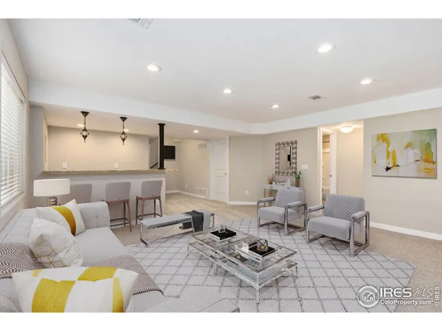 a bathroom with a bath tub sink mirror vanity and toilet
