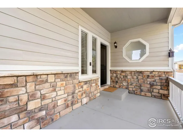 a view of a door and wooden floor