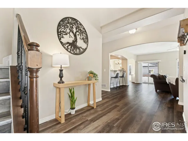 a kitchen with granite countertop a refrigerator and a sink