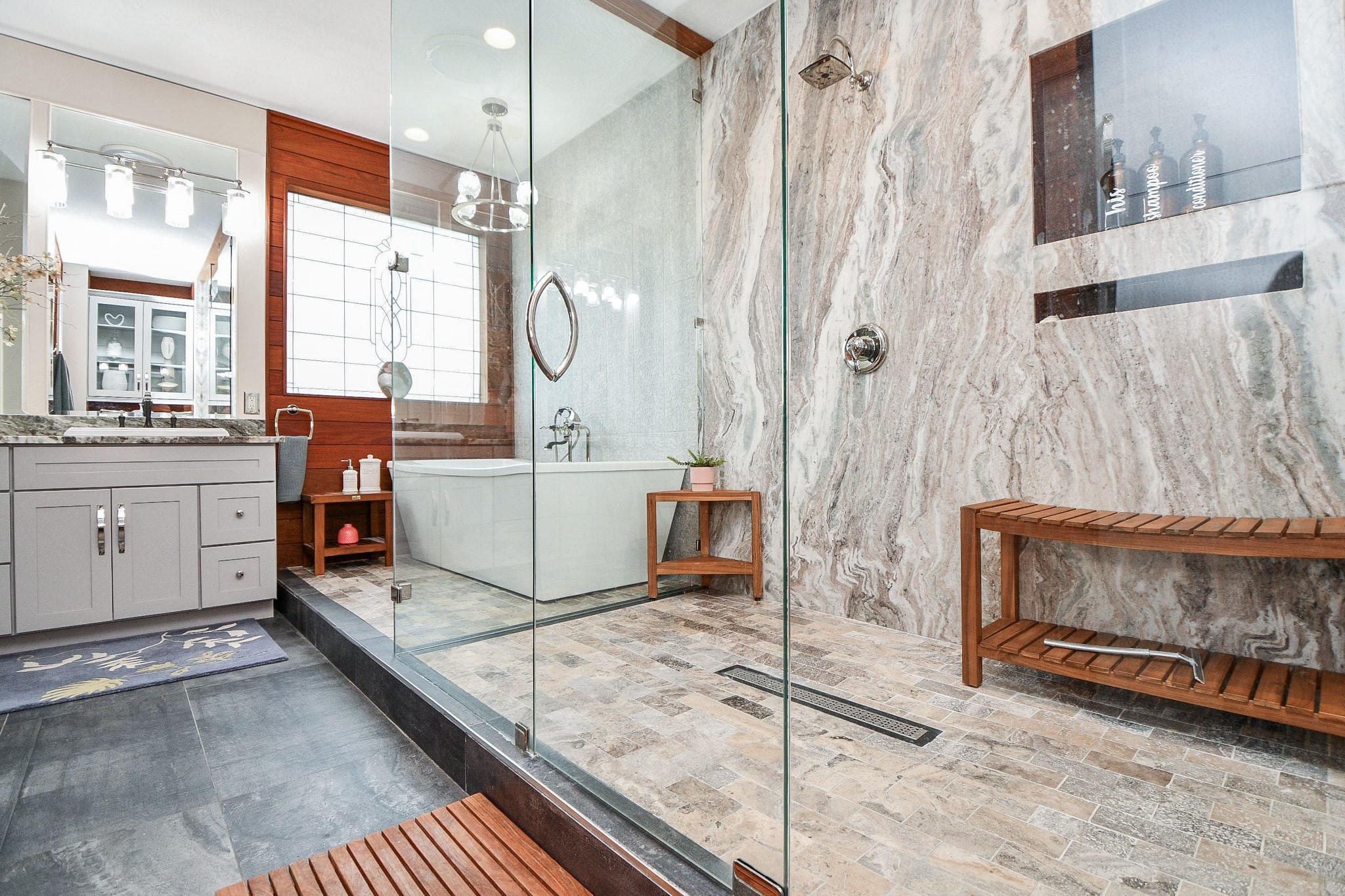 3680 Eula Morgan Road Katy, TX 77493 - Photo 4 of 50 What a marvelous view from the oversized walk-in shower, to long soaking tub, vanity, and the art-deco inspired window, over the bathtub in the primary bathroom.