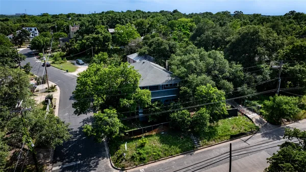 an aerial view of house with yard