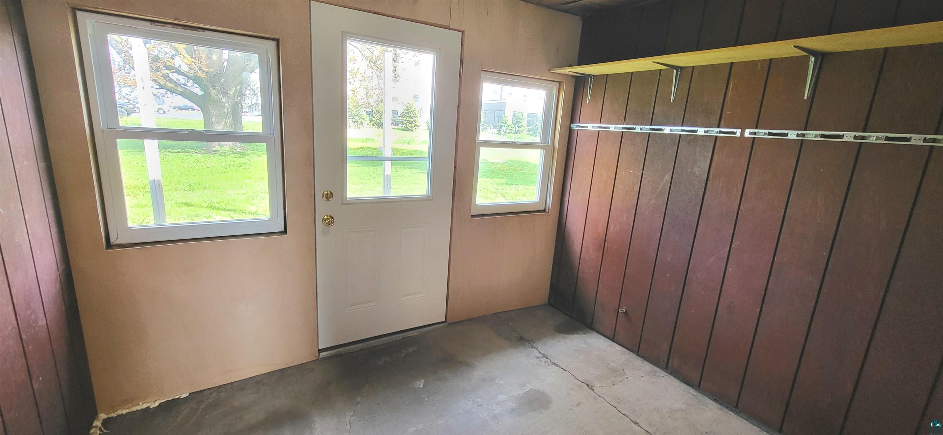 56 East 2nd Street Superior, WI 54880 - Photo 17 of 18 Entry area with a white door featuring a window panel, flanked by two additional windows