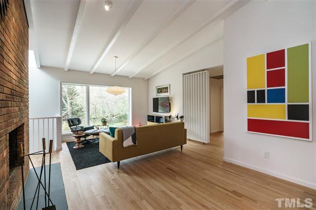 3322 Ocotea Street Raleigh, NC 27607 - Photo 11 of 31 a living room with furniture and a large window